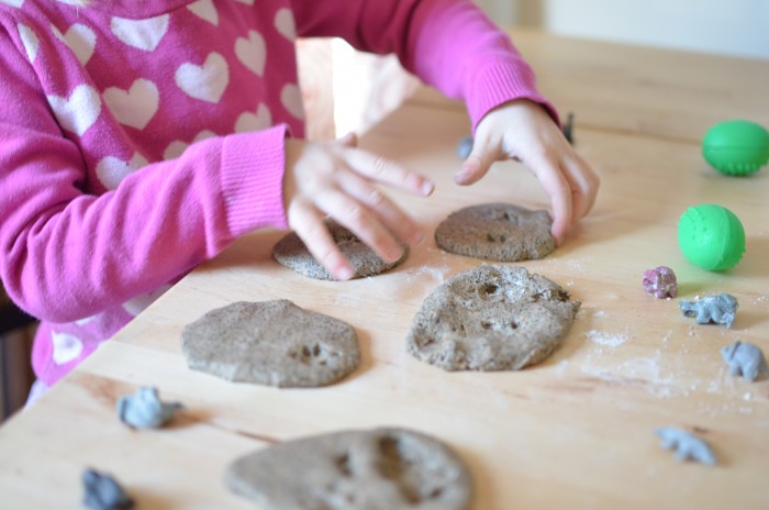 fossil dough - close up of girl playing with fossil dough