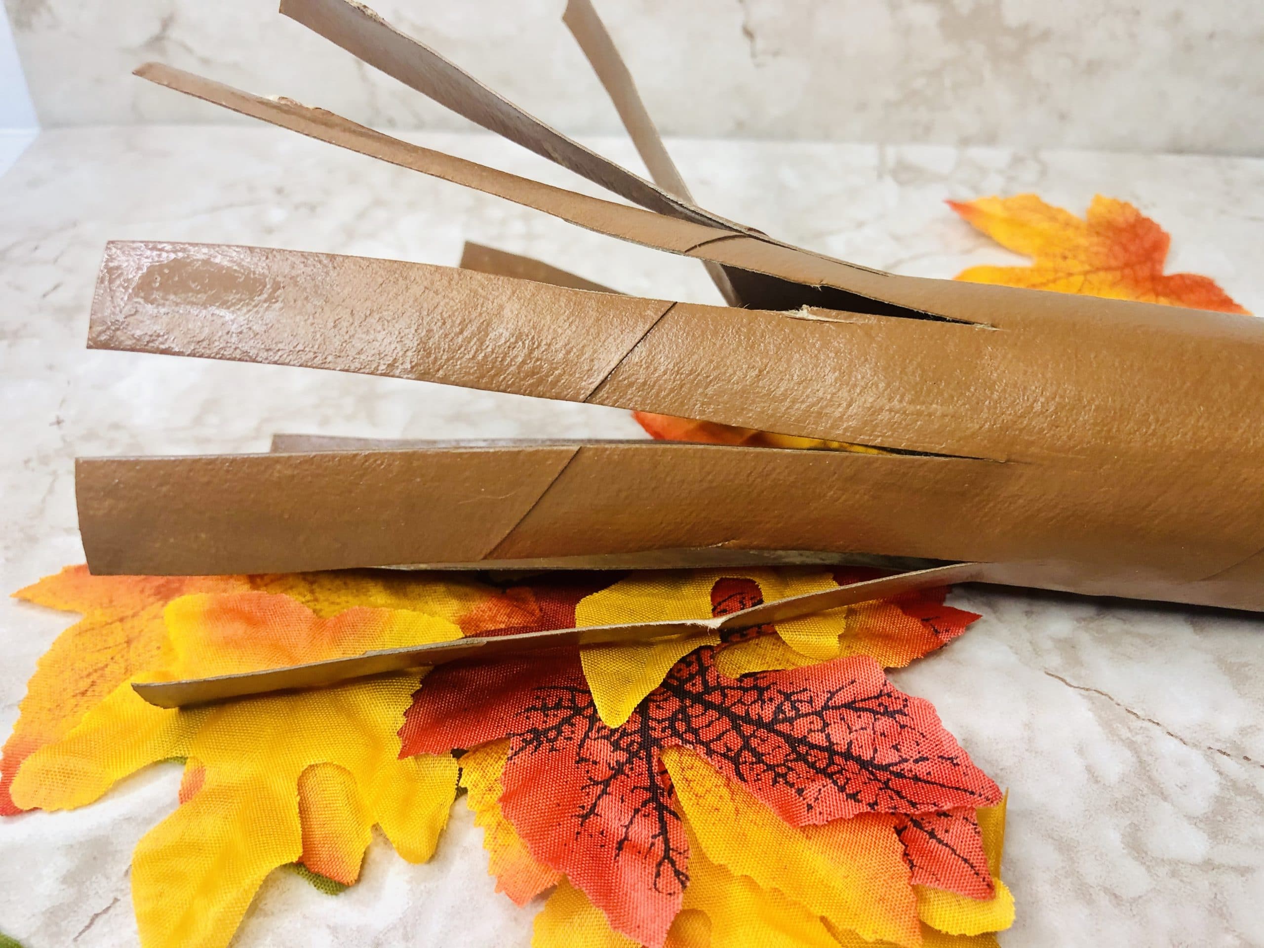 cut strips of paper towel roll for branches of thankful tree