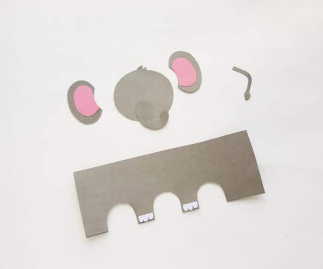 Cute elephant craft - cardstock pieces placed together, pink ears and trunk on face