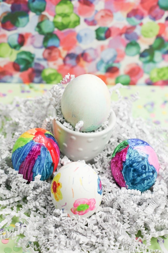Easter egg craft - three colorful Easter eggs and one in an egg cup