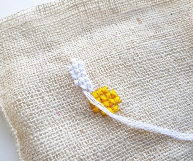 Easy Cross Stitch Pattern - burlap fabric with yellow center and one white petal complete