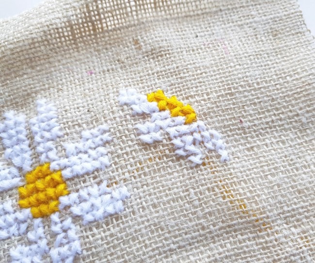 Easy Cross Stitch Pattern - continuing the second daisy pattern on the burlap fabric