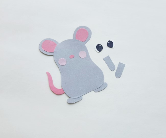 Mouse Papercraft - body of mouse cutout with feet and ears glued on, along with cheeks and nose
