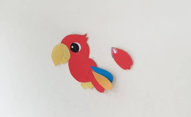 parrot paper bookmark - parrot cutout with glued wing next to it