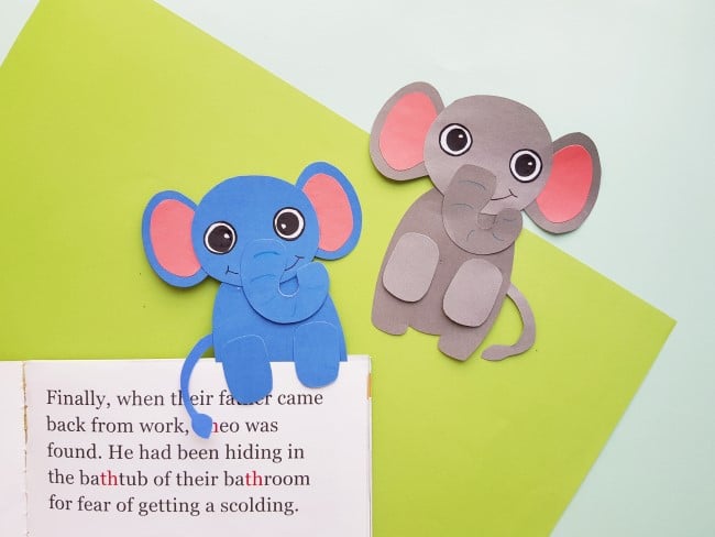 elephant bookmarks - one blue elephant and one brown elephant bookmark together on the pages of a book