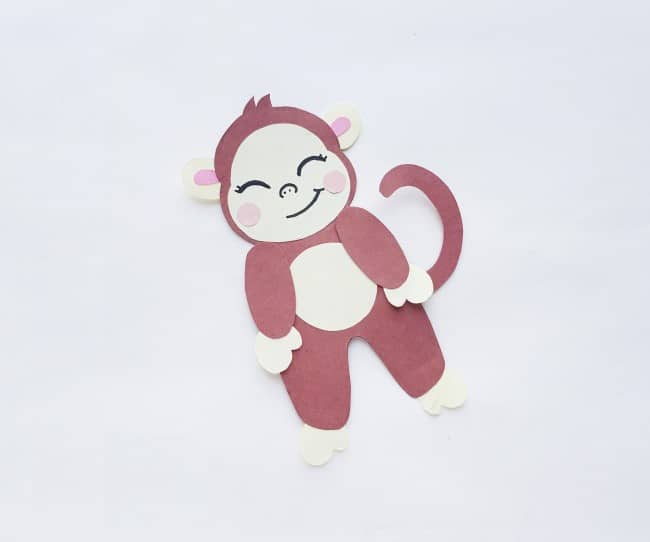 monkey craft - all parts glued to body cutout, cute face drawn on the monkey bookmark