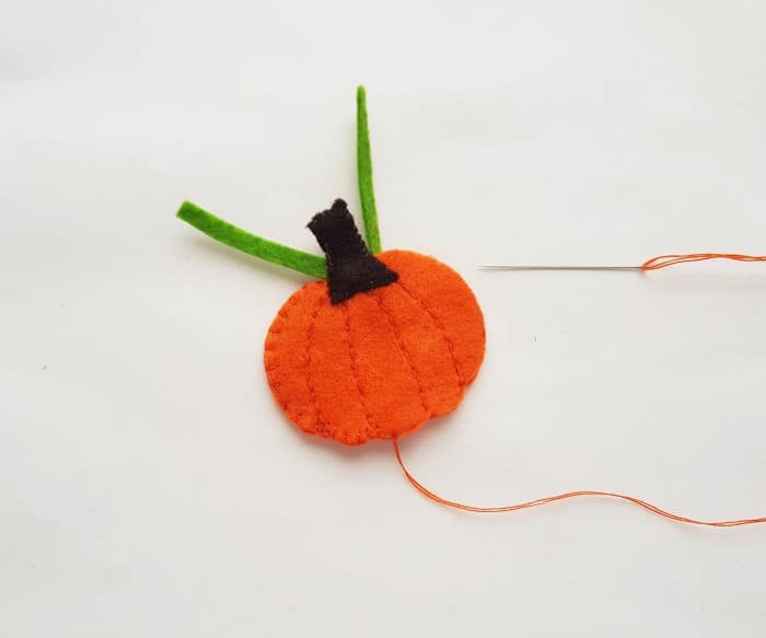 felt pumpkin craft - step six: stitching sides together