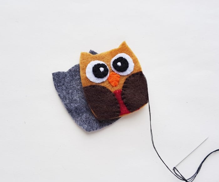 preparing to stitch the back to the front of owl plush