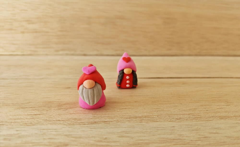 two clay love gnomes